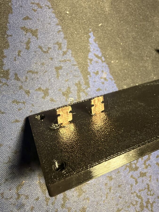 Spade terminals viewed from the harness-facing side